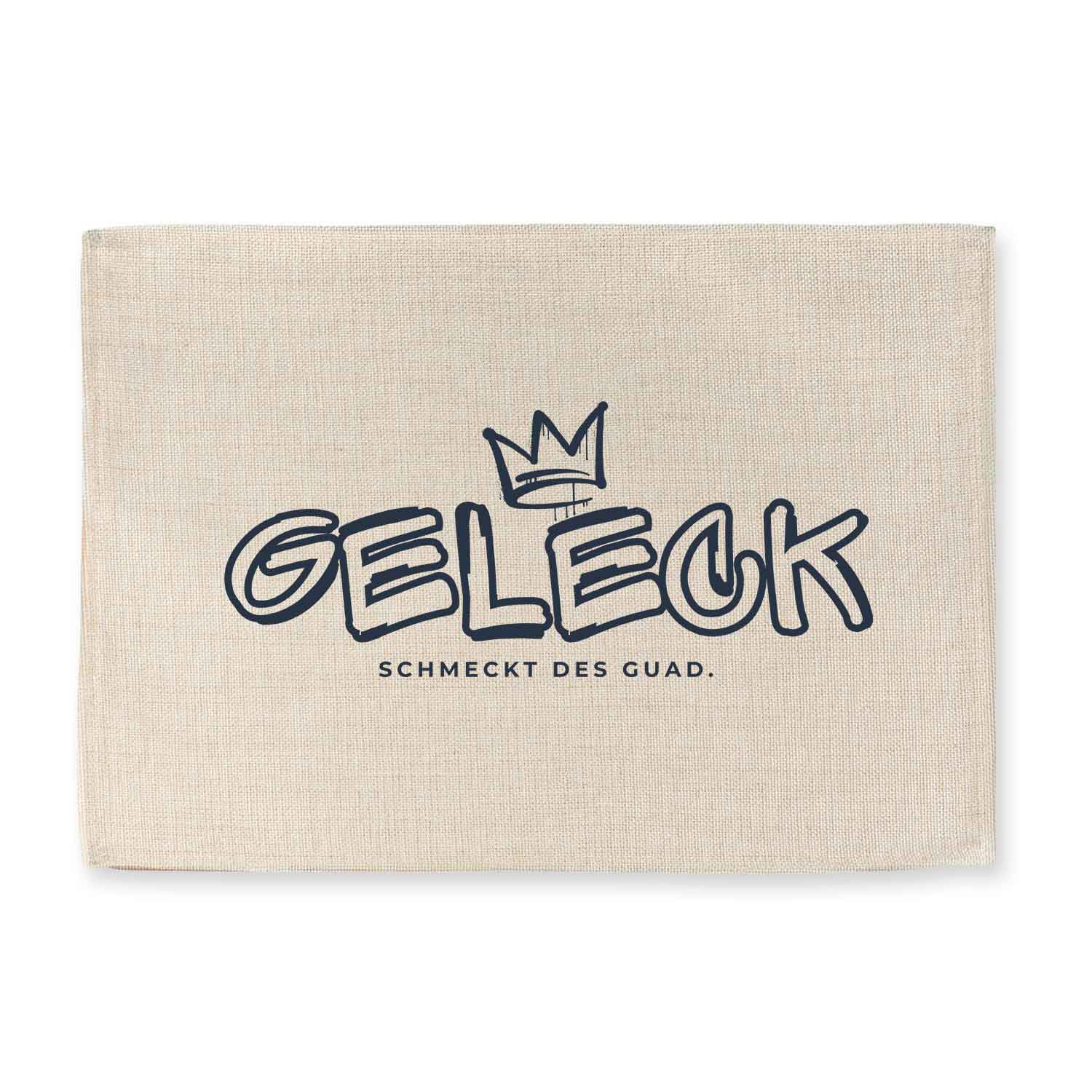 Abwaschbares Tischset mit bayerischem Spruch „Geleck“, Jute-Look, rechteckig, hochwertiger Druck.