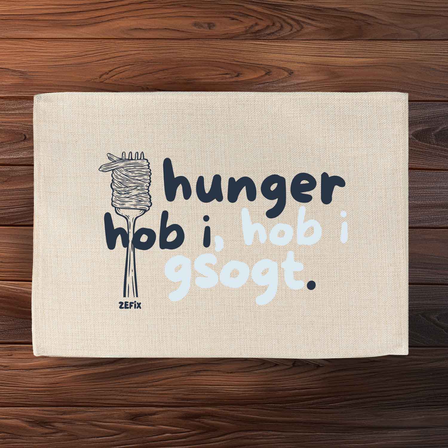 Abwaschbares Tischset in Jute-Optik mit bayerischem Spruch „Hunger hob i“ und strukturierter Oberfläche.