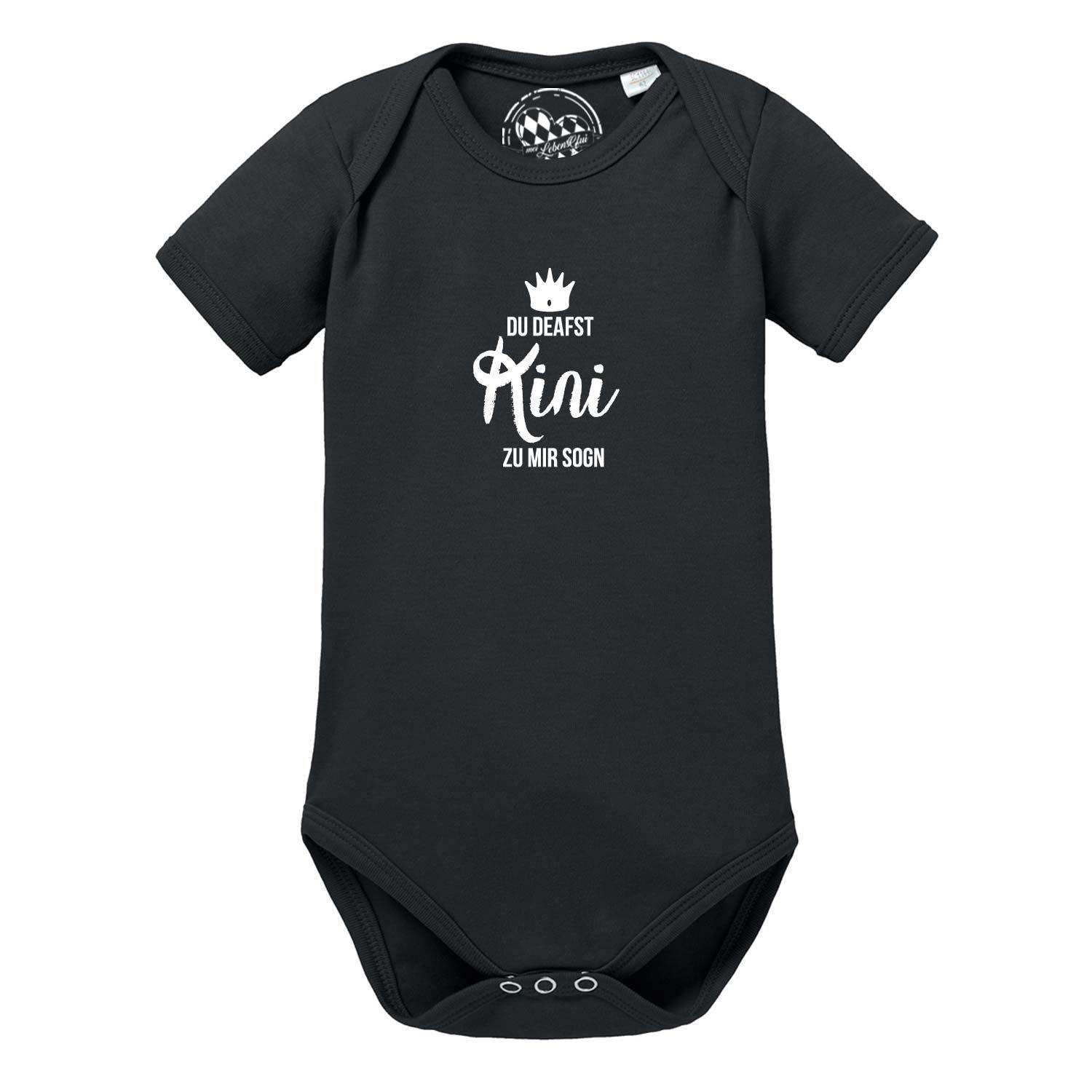 Schwarzer Baby Body Kini mit weißem Aufdruck "DU DEAFST Kini ZU MIR SOGN" und Krone.