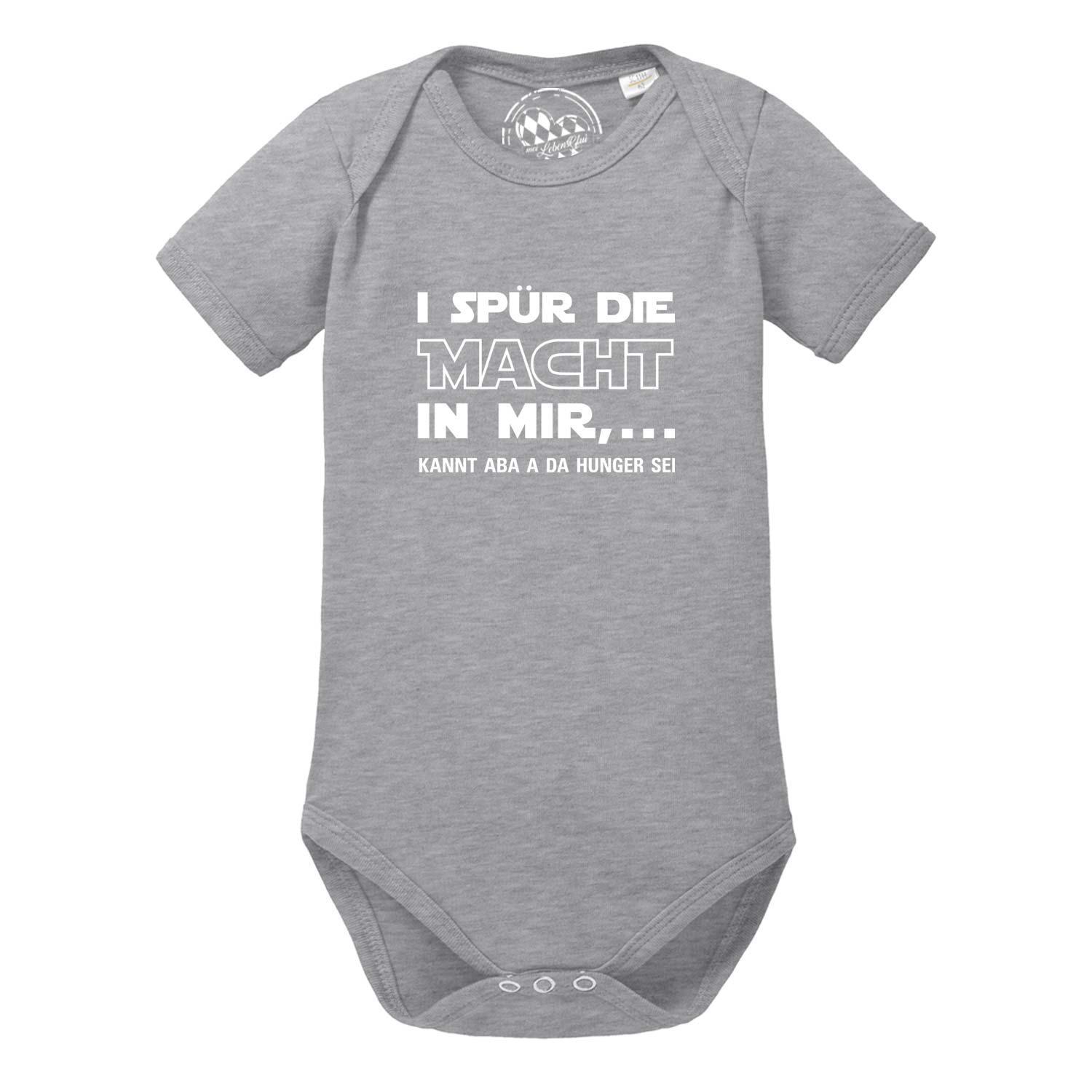 Hellblauer Babybody mit kurzen Ärmeln, schwarzem Schriftzug „I spür die Macht…“ und weichem Baumwollstoff.