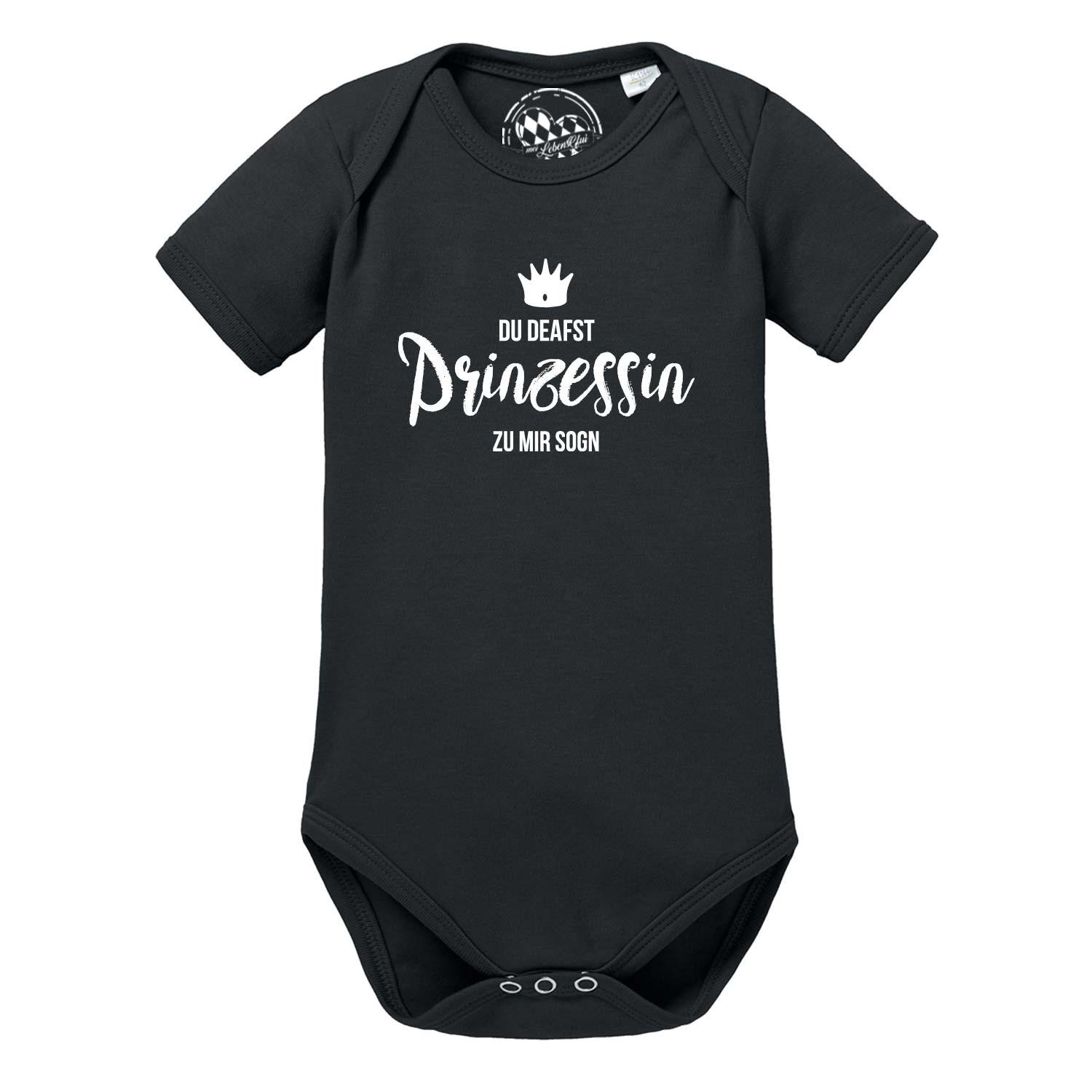 Weißer Babybody mit kurzen Ärmeln, pinkem Schriftzug „Prinzessin“ und kleiner Krone auf der Brust; aus Baumwolle.