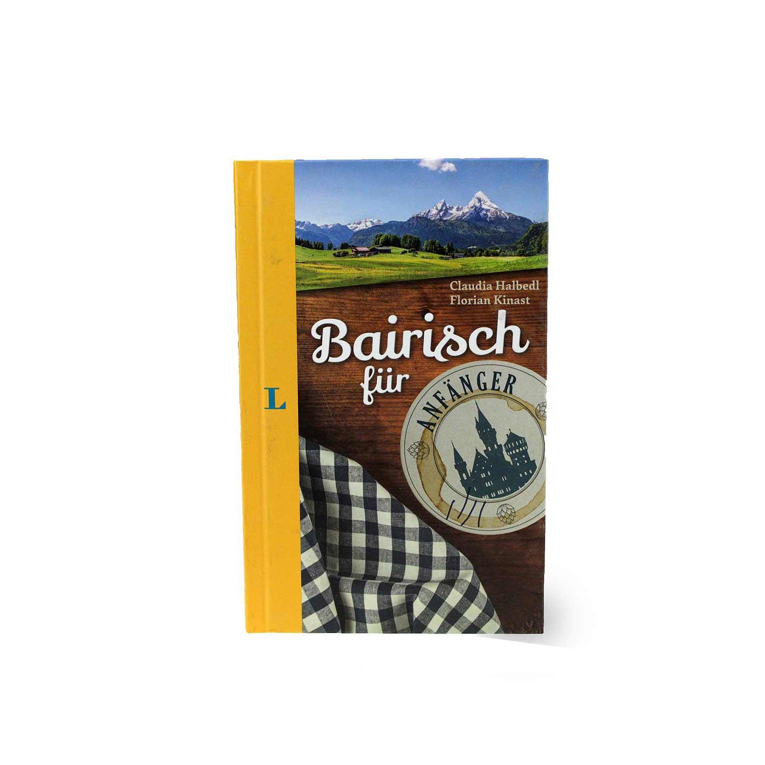 Taschenbuch in Gelb mit weiß-blauem Rautenmuster, schwarzer Schriftzug „Bairisch für Anfänger“ auf dem Cover.