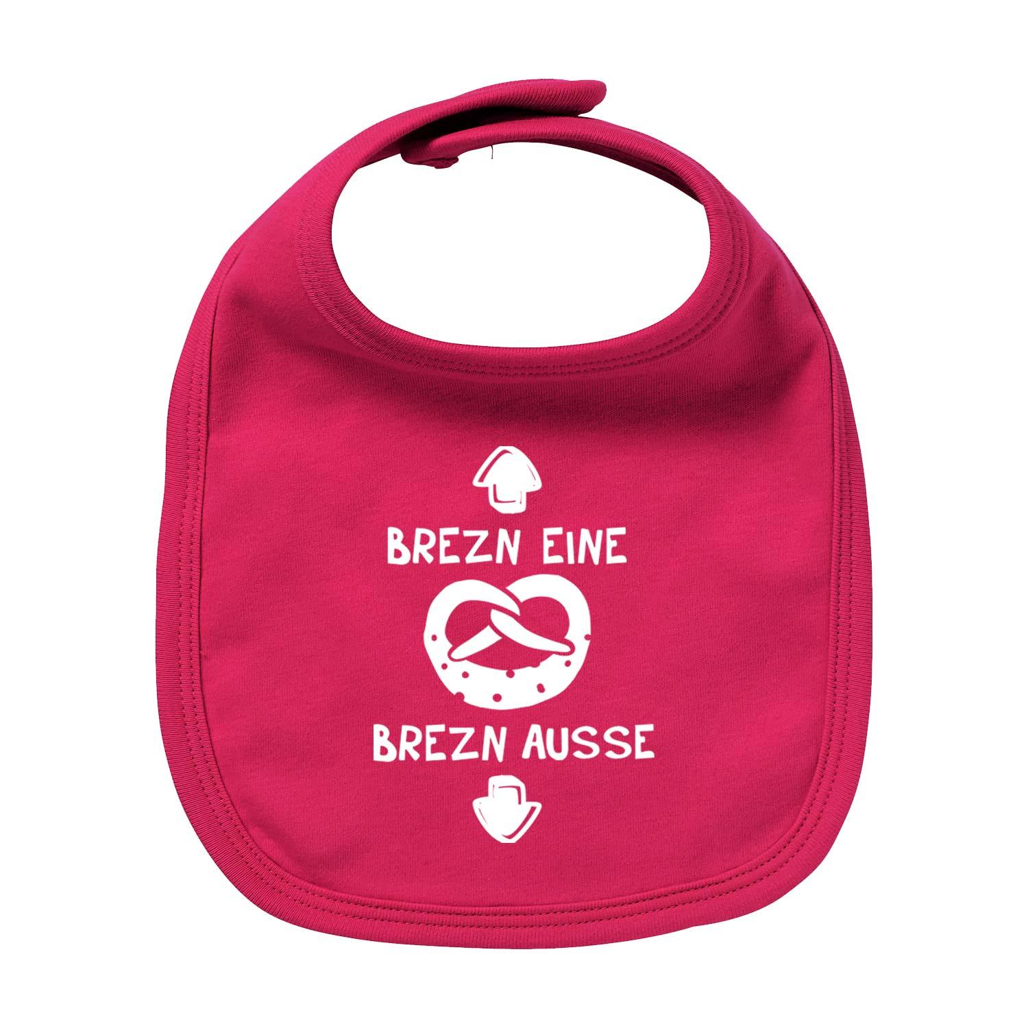 Lätzchen Brezn in leuchtendem Pink mit weißem Brezel-Motiv und Pfeil-Spruch "Brezn Eine, Brezn Ausse".