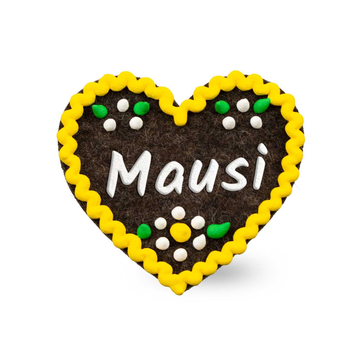Herzförmiger Filz-Anstecker mit gesticktem „Mausi“-Schriftzug und Ziernaht, Rückseite mit Sicherheitsverschluss, ca. 6,5 x 7 cm.