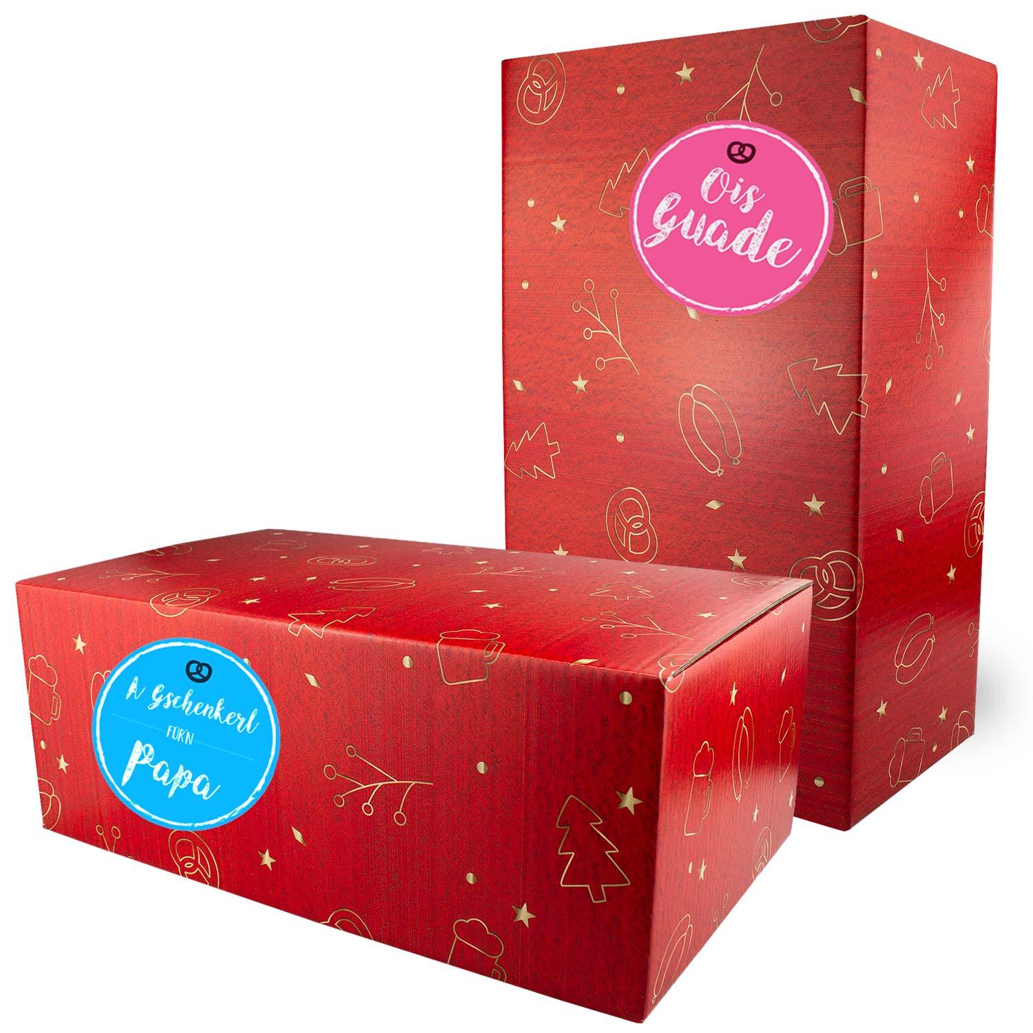 Rote Weihnachtsbox Koids Glüh-Bier, eine rechteckige und eine hohe Box, mit goldenen Weihnachtsmotiven und Sternen.