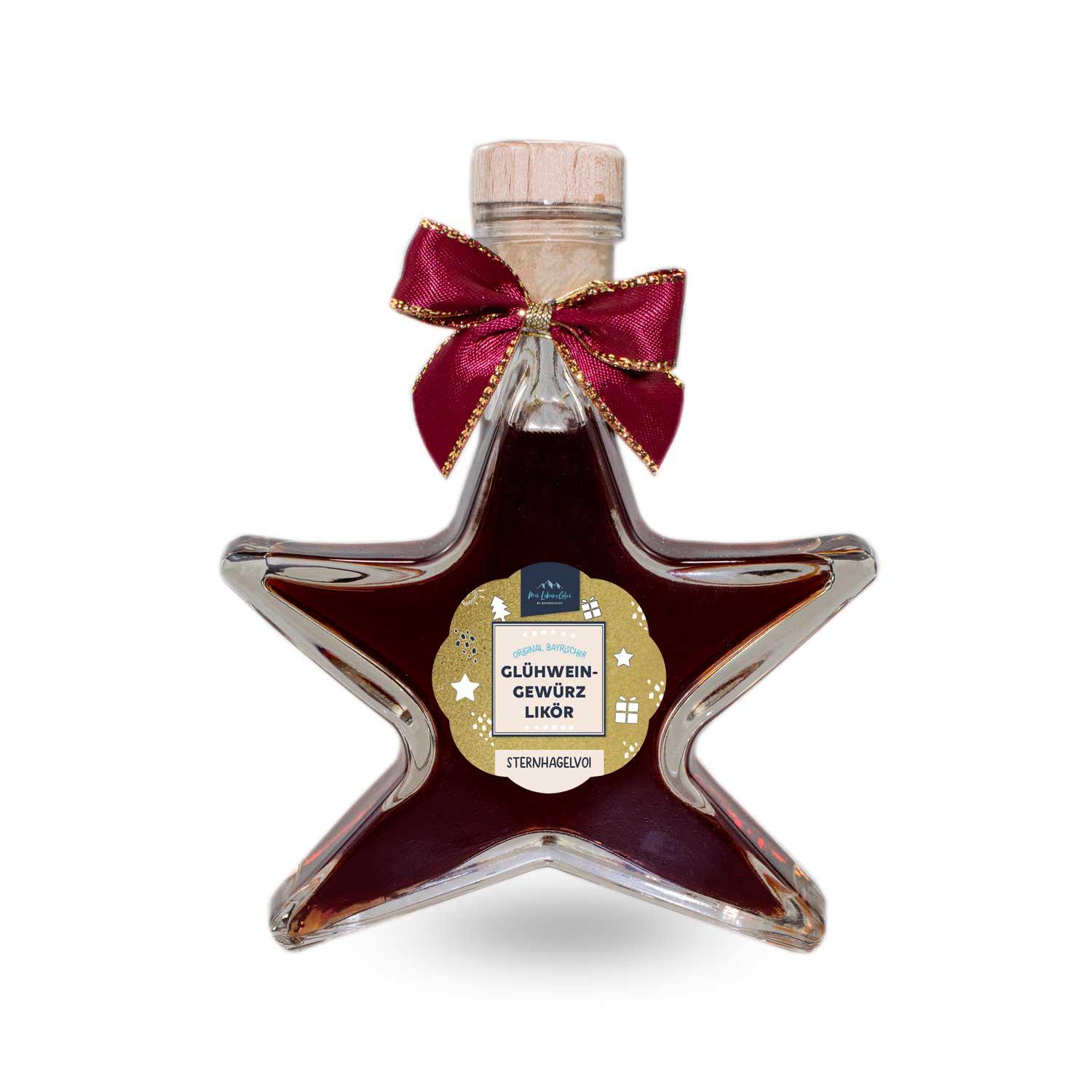Glühweingewürz-Likör in sternförmiger Glasflasche mit goldfarbenem Schriftzug und roten Gewürzeinschlüssen