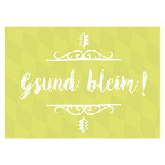Grußkarte "Gsund bleim!" in Lindgrün mit Rautenmuster und weißem Schriftzug sowie floralen Verzierungen.