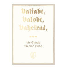 Glückwunschkarte Hochzeit valiabt, valobt, vaheirat mit goldener Schrift und bayerischem Spruch auf hellem Hintergrund.