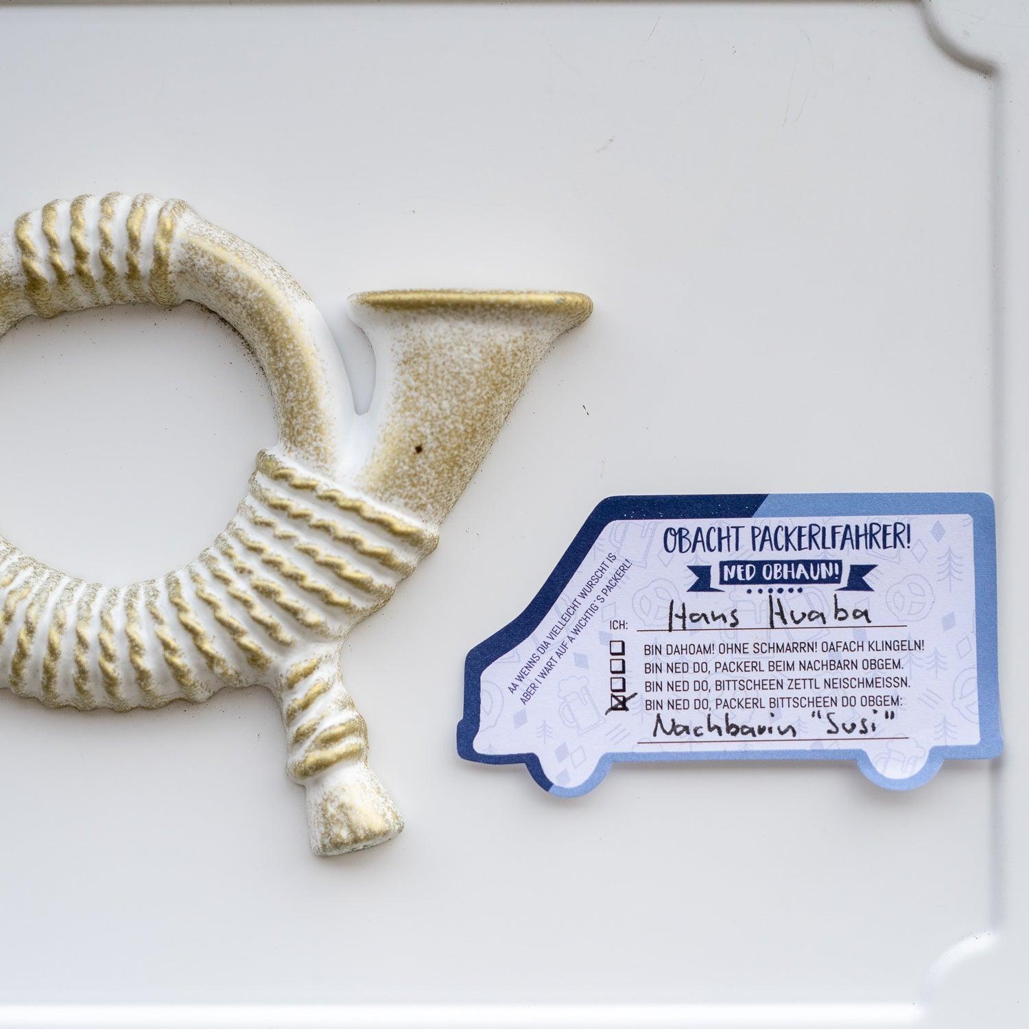 Haftnotizen in Lieferwagen-Form mit blauem Motiv und bayerischem Schriftzug „Haftnotiz fia Packerlfahrer“, 50 Blatt.