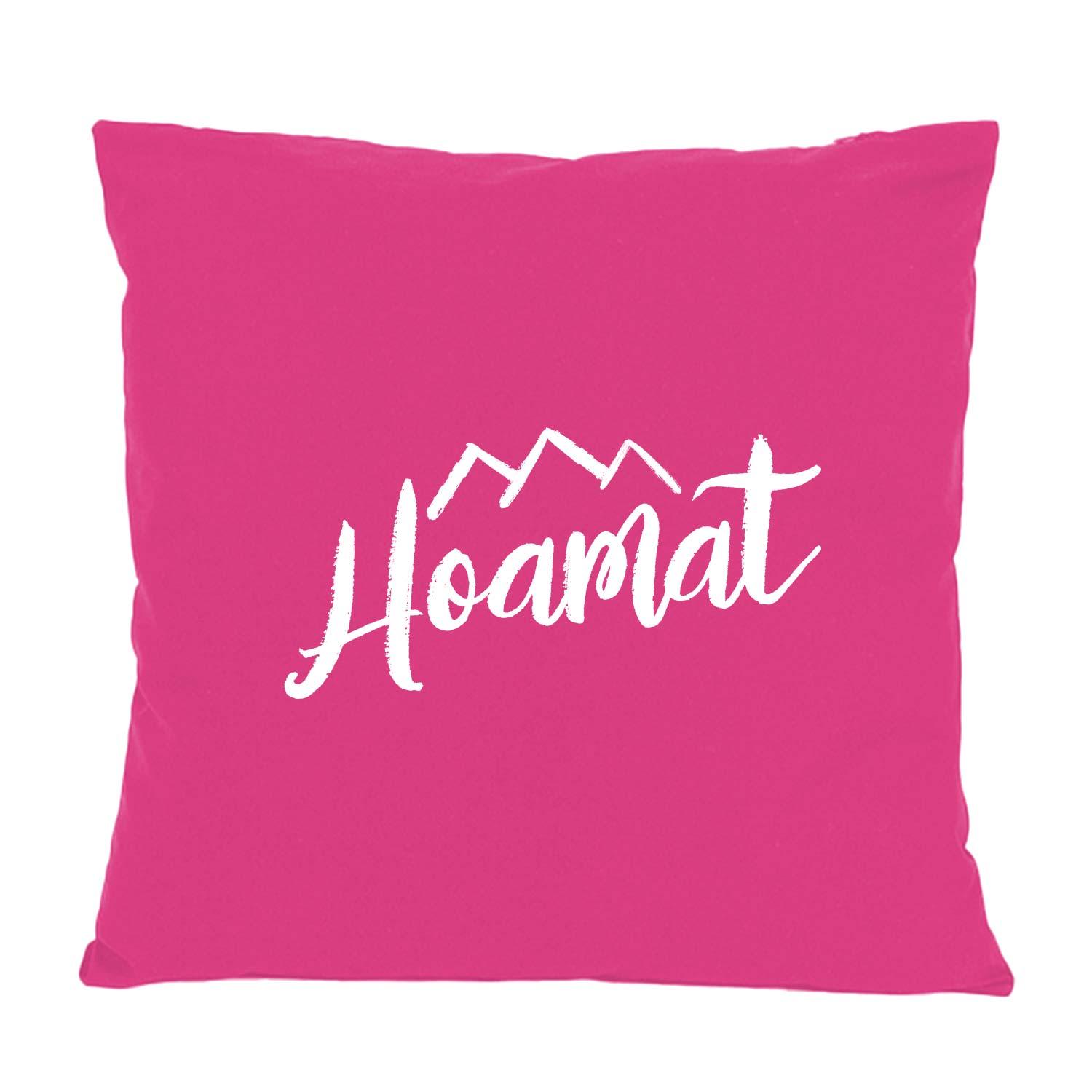 Pinkfarbenes Kissen Hoamat mit weißem Schriftzug und Bergmotiv, ideal für gemütliche Dekoration.