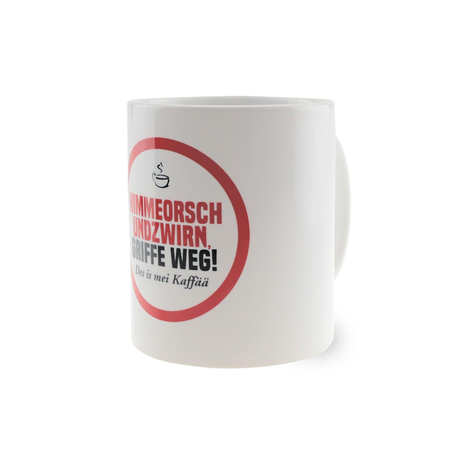 Weiße Keramiktasse mit schwarzem Henkel und Aufdruck „Himmeorschundzwirn, GRIFFE WEG...“, ca. 330 ml, 9,6 cm hoch.