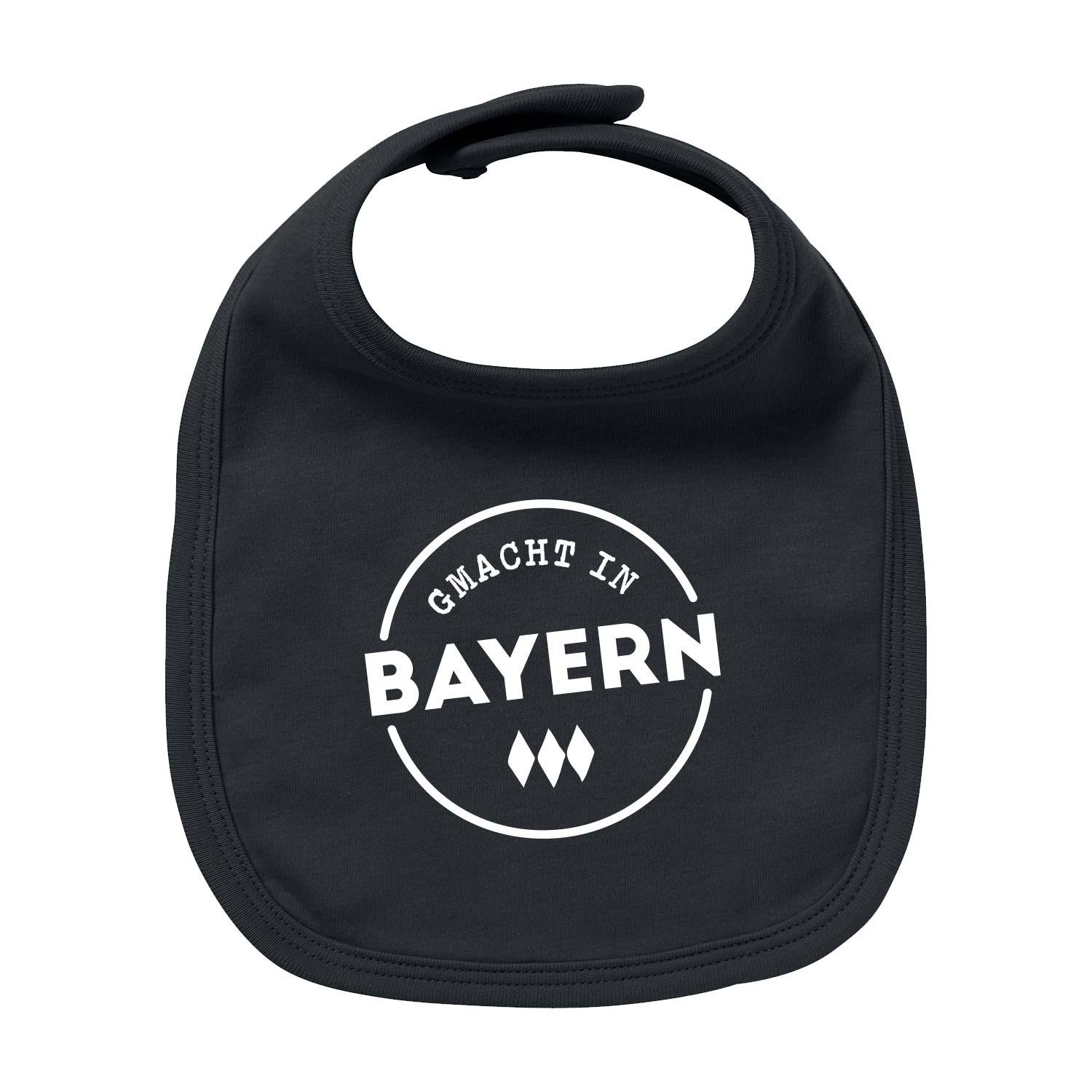 Baby-Lätzchen mit sichtbarem Schriftzug „Gmacht in Bayern“, aus Bio-Baumwolle, in halbrunder Form, 35 x 22 cm.