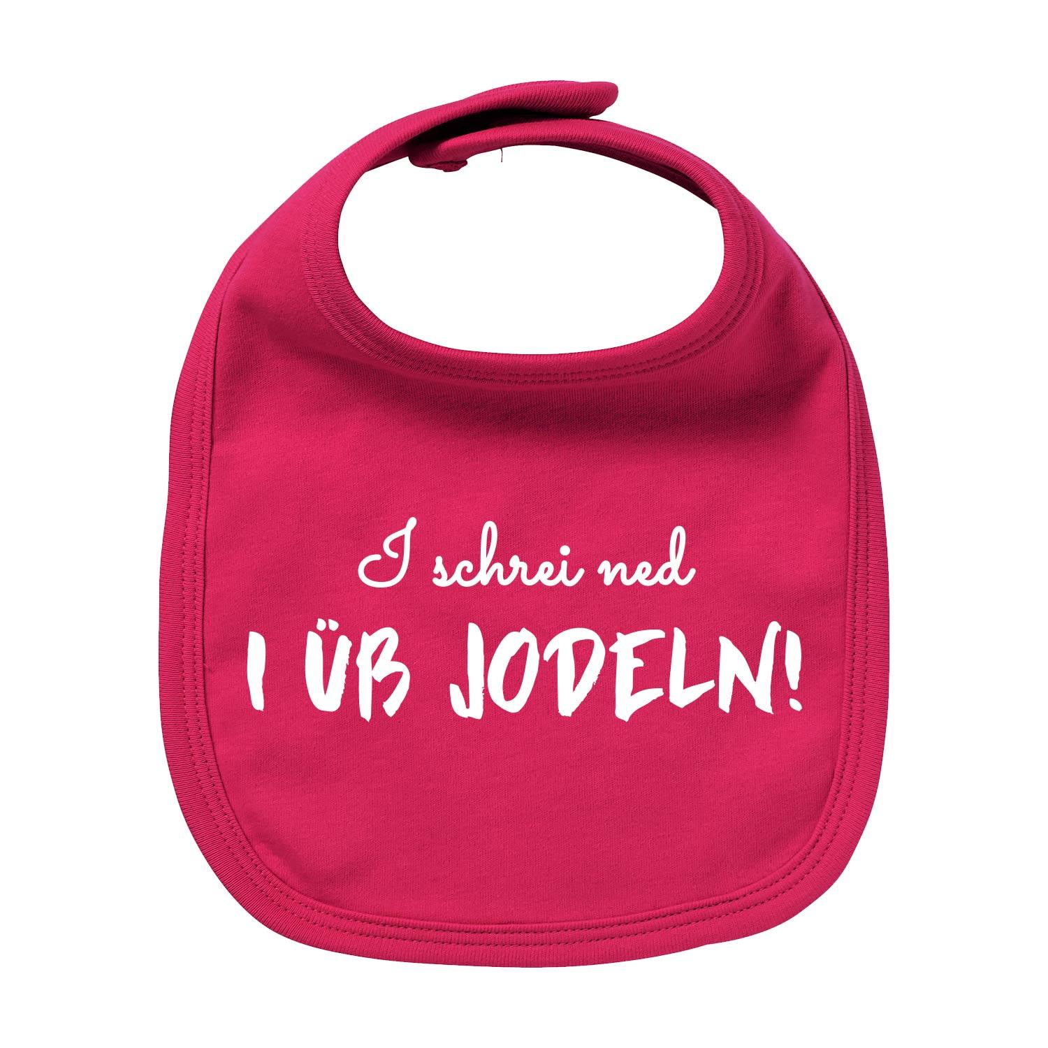 Hellblaues Baby-Lätzchen mit weißem Schriftzug „I üb jodeln“ und rot-weißem Herz, aus Bio-Baumwolle gefertigt.