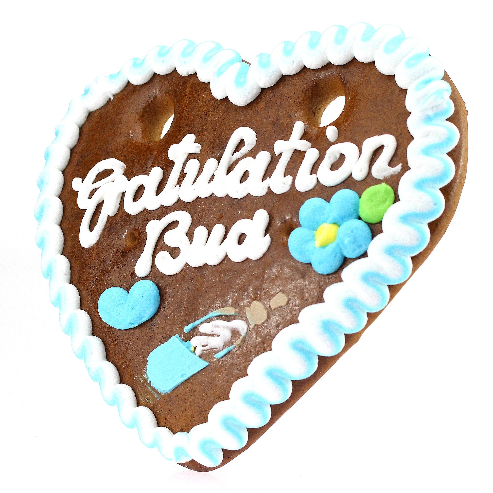 Herzförmiges Lebkuchenherz mit blau-weißem Zuckerrand und Schriftzug „Gratulation Bua“, handgefertigt, 14 × 17 cm.