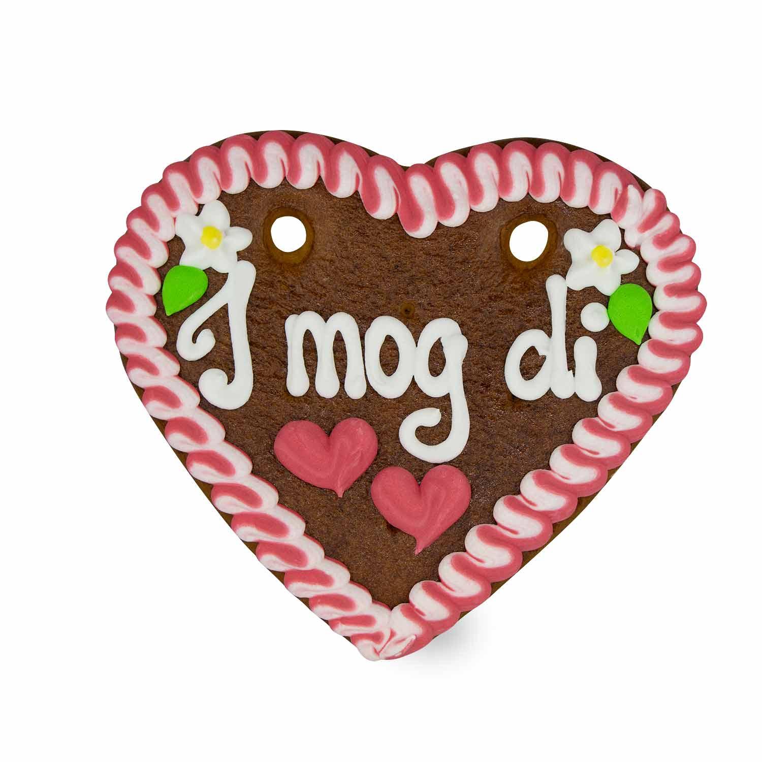 Herzförmiges Lebkuchenherz mit weißem Zuckerrand, rotem Herz-Dekor und Schriftzug „I mog di“ in Weiß.