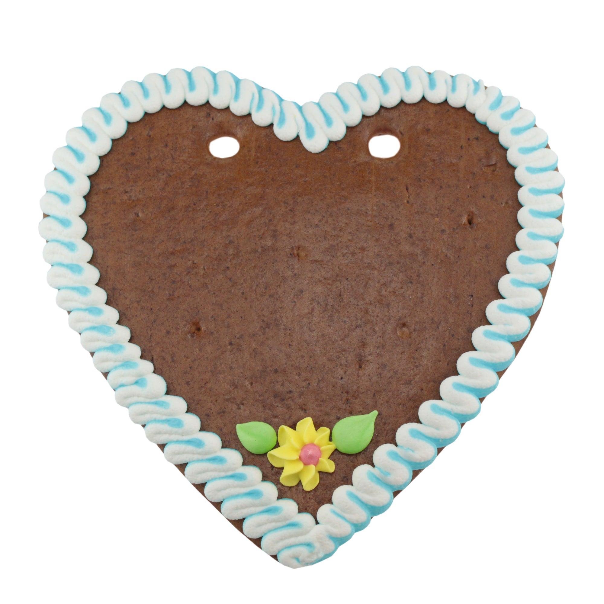 Herzförmiges Lebkuchenherz mit weißer Zuckerglasur, blauem Rand und individualisierbarem Schriftzug, braun; ca. 22×23 cm, 180 g.