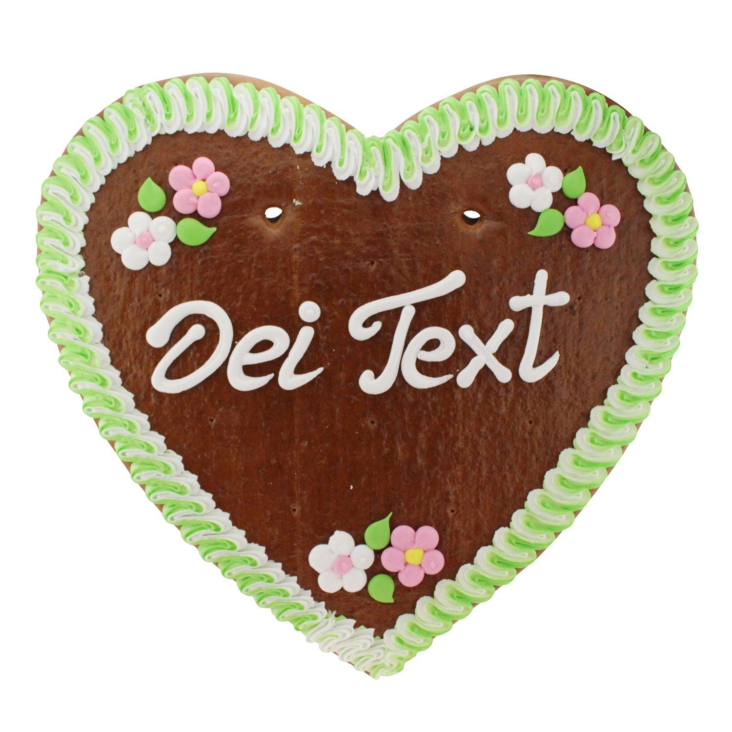 Großes herzförmiges Lebkuchenherz mit Zuckerguss-Verzierung, weiß-rotem Rand und individuellem Textfeld. Ca. 48 × 50 cm, 1 kg.
