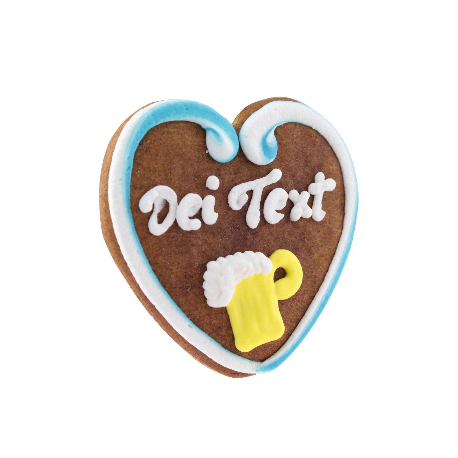 Herzförmiges Lebkuchenherz mit weißer Zuckerverzierung und personalisierbarem Schriftzug auf braunem Teig, 10 × 10 cm.