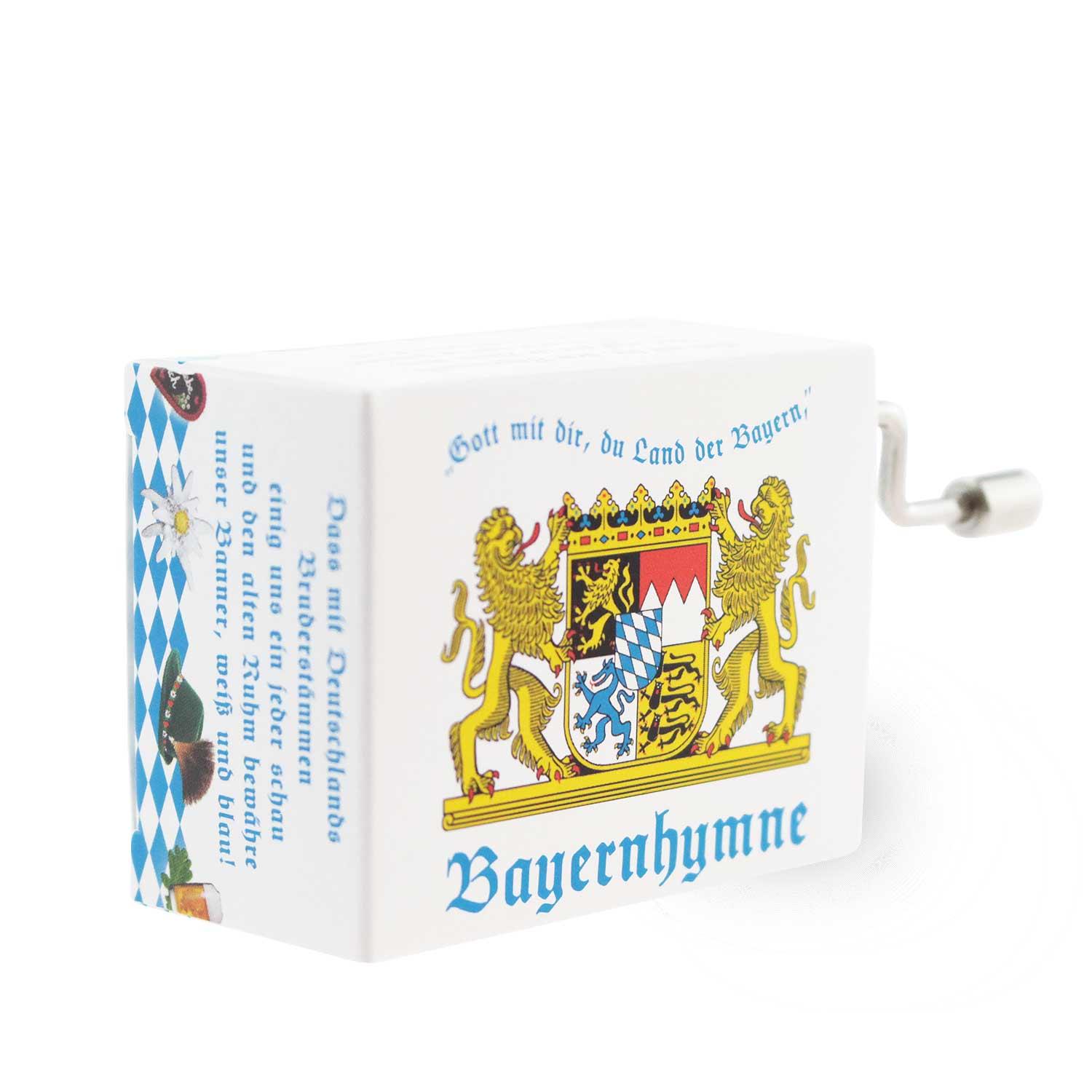 Mini-Drehorgel in Blau-Weiß mit bayerischem Rautenmuster, Kurbelgriff, spielt die Melodie der Bayernhymne.