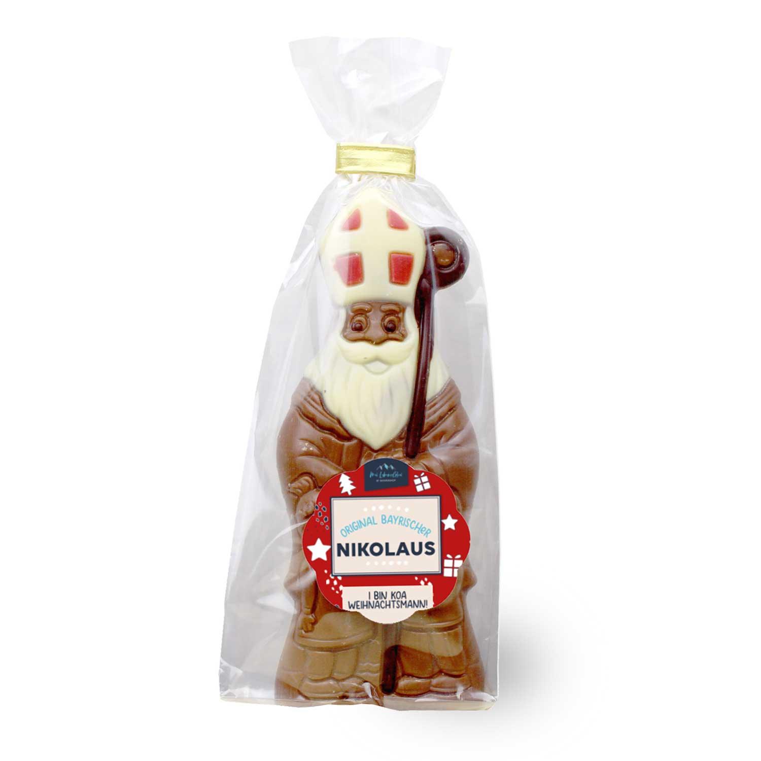 Schokoladenfigur in Form eines Bischofs aus Vollmilch, braun mit roten, weißen und goldenen Details, 60 g.