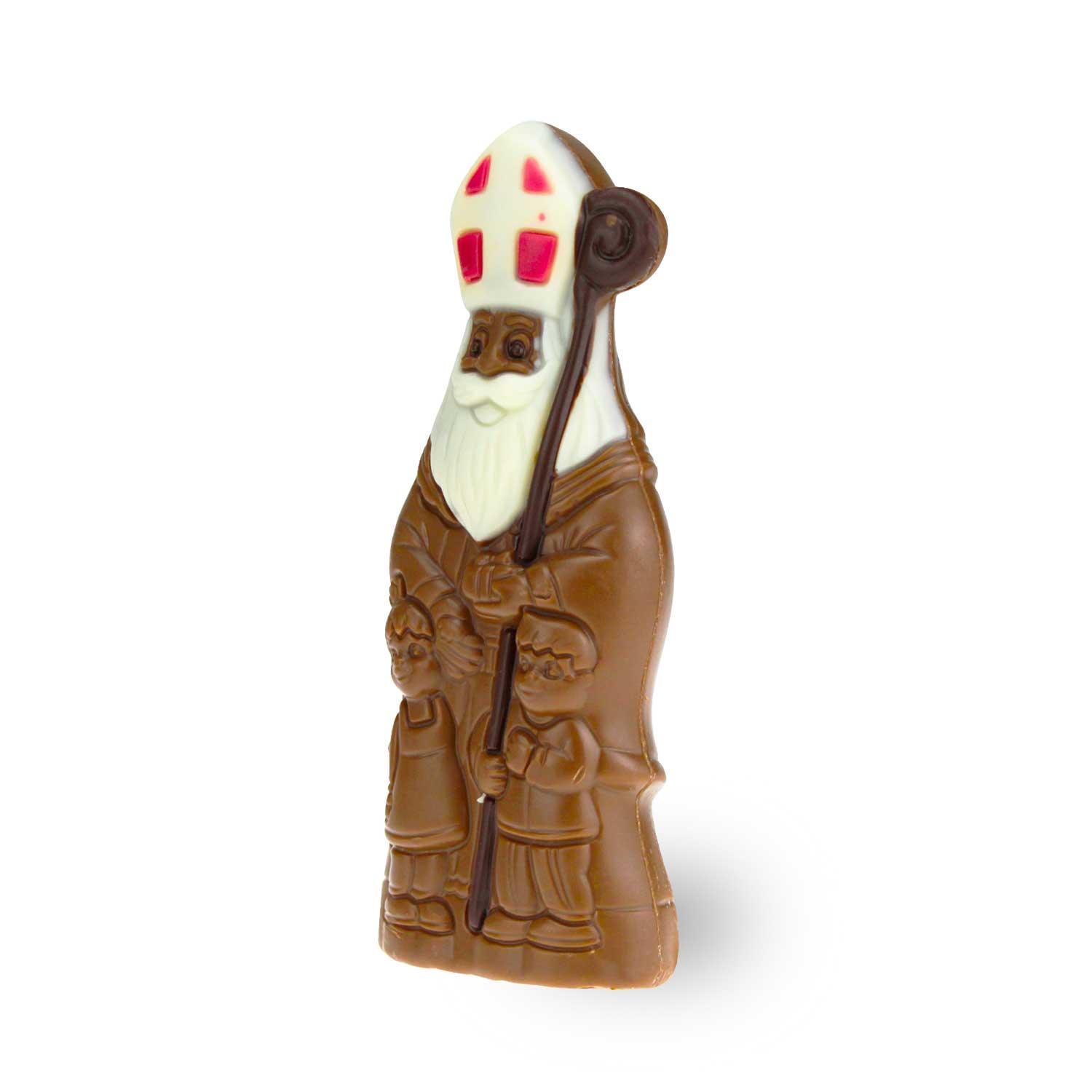 Schokoladenfigur in Bischofsform aus brauner Vollmilchschokolade mit goldenen und roten Details, ca. 13,5 cm hoch.