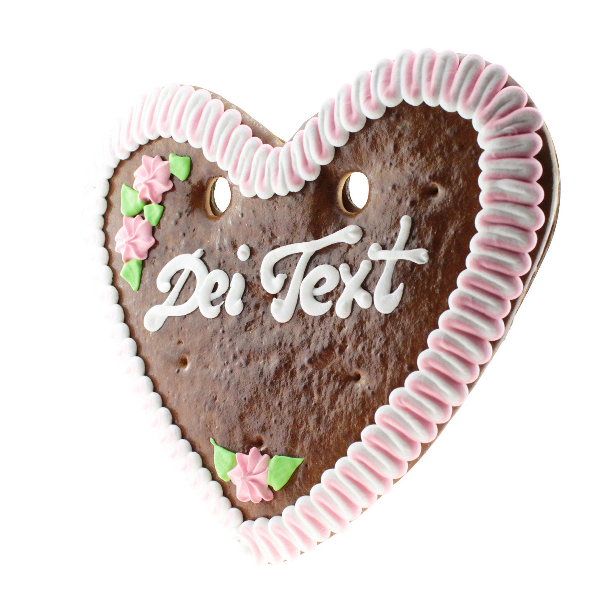 Herzförmiges Lebkuchenherz mit weißer und blauer Zuckerverzierung, beschriftbar in zwei Textzeilen, ca. 32 x 28 cm.