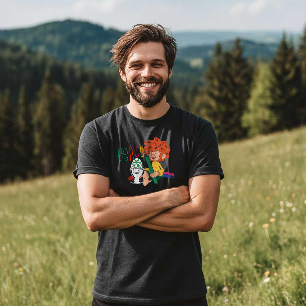 Lachender Mann in schwarzem T-Shirt mit rotem Pumuckl und blauem Schriftzug Eier Ostern im Grünen