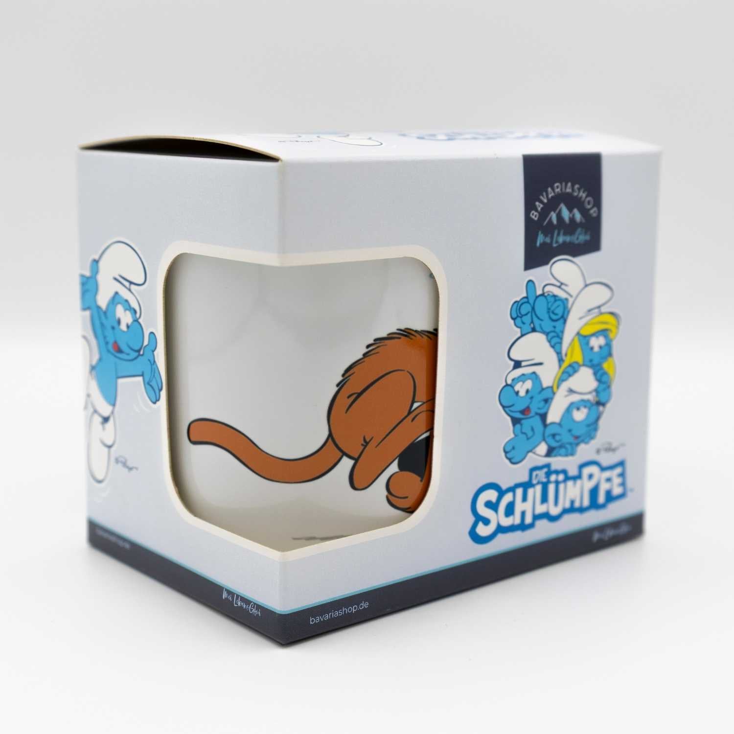 ®Die Schlümpfe Emailletasse Zupf di! in Geschenkbox, mit Schlumpf und braunem Kater auf weißem Hintergrund.