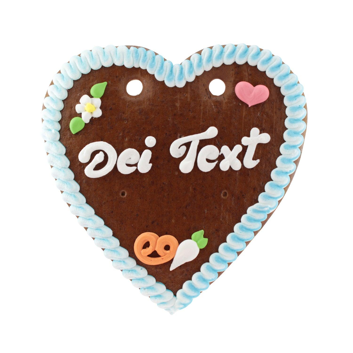 Herzförmiges Lebkuchen in Braun mit rosafarbenem Rand, weißer Zuckerschrift und Blumenmotiv, handgefertigt, ca. 22 x 23 cm.