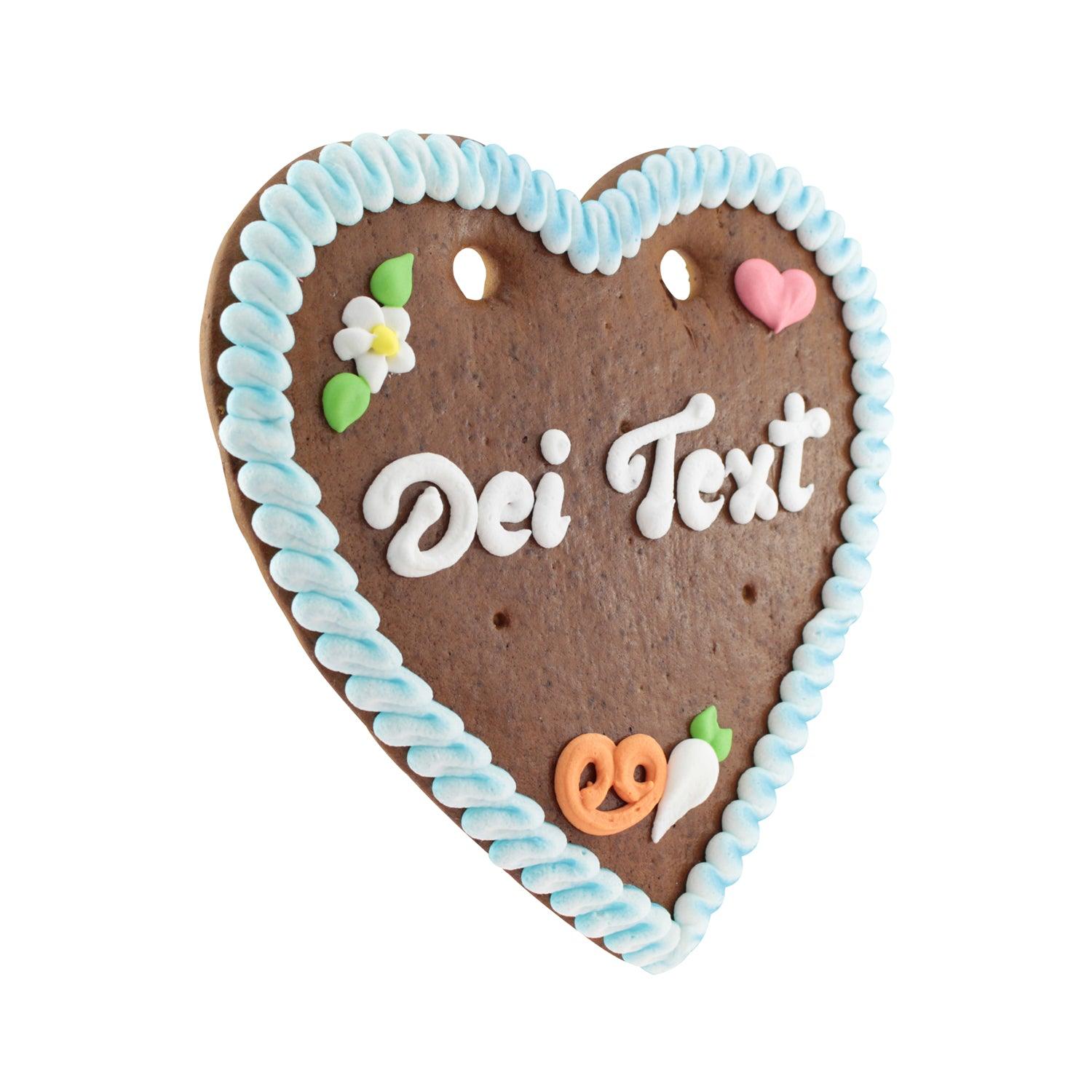 Braunes Lebkuchenherz mit weißer, rosa und blauer Zuckerschrift, verziert mit Zuckerblumen und Randdekor, ca. 22×23 cm.